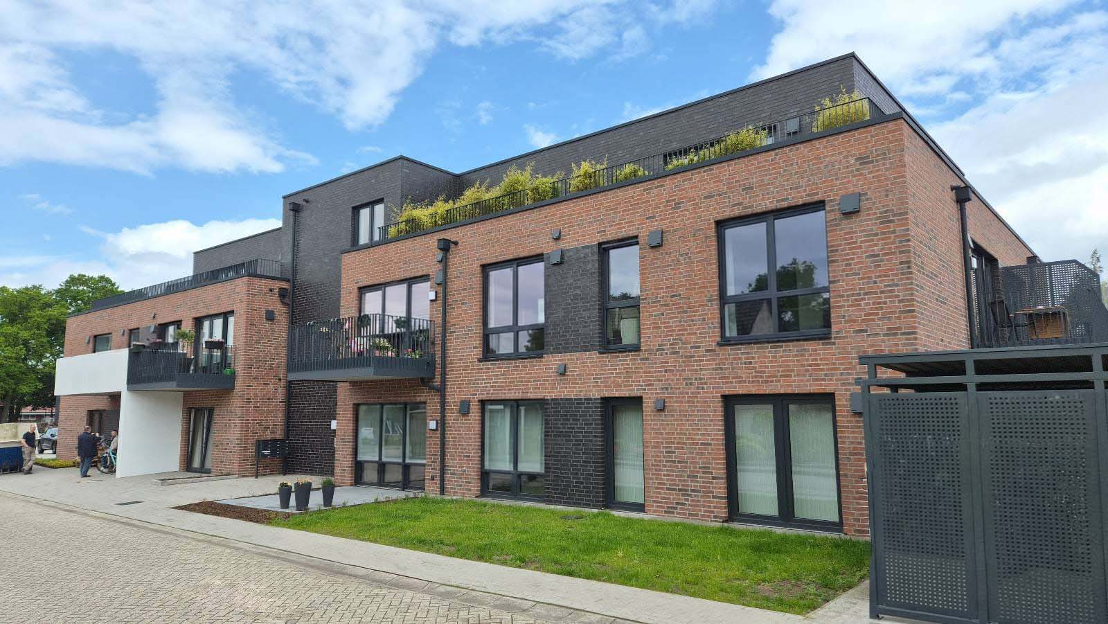 Neubau eines Wohn- und Geschäftshauses mit 14 Wohnungen und einer Gewerbeeinheit in Langen - Nachhaltiges und energieeffizientes Bauen mit QNG Zertifizierung